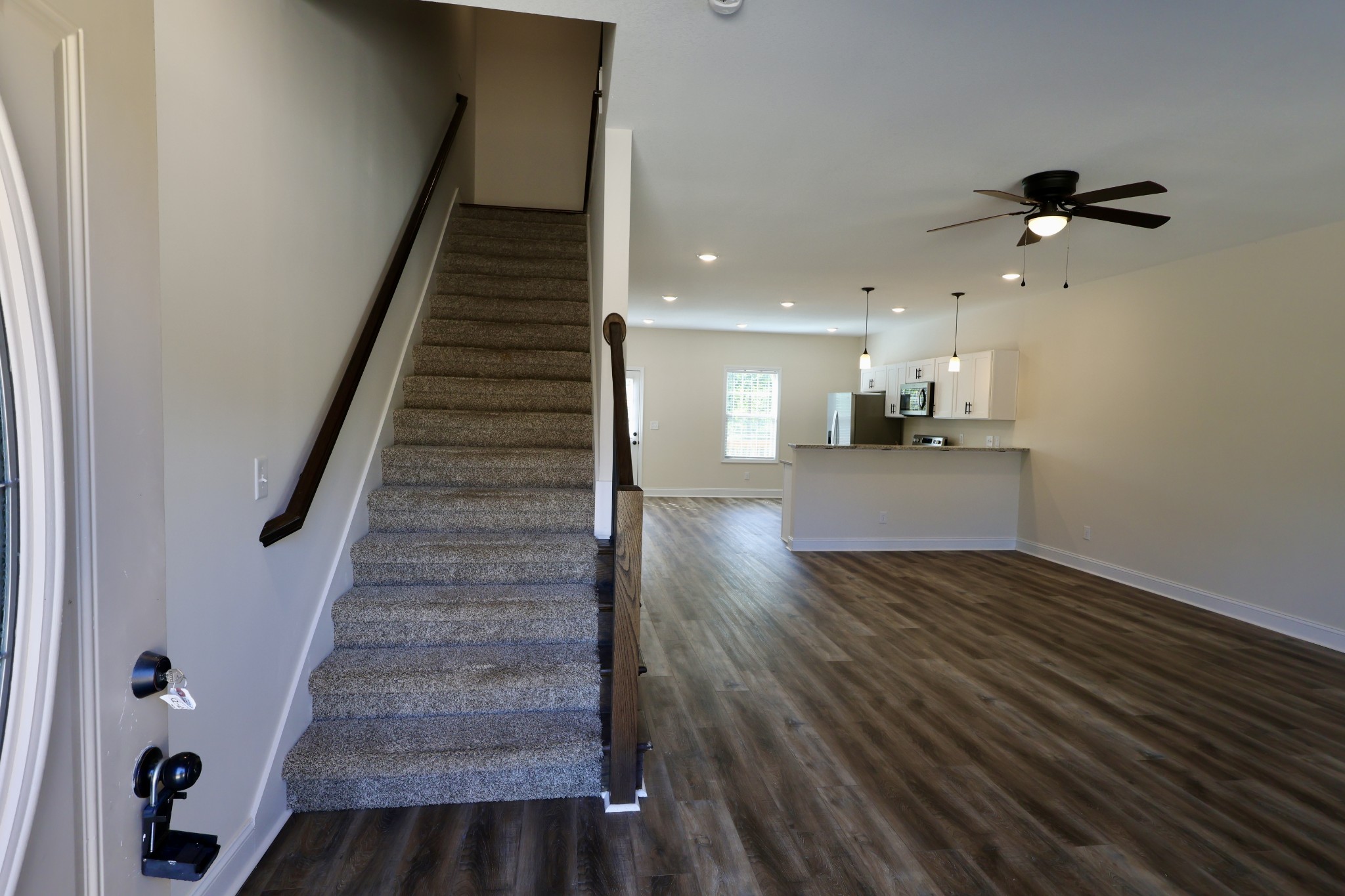 500 Peachers Mill Road, Unit B4 Clarksville, TN 37042 - Photo 2 of 26 a view of a hallway with wooden floor and staircase
