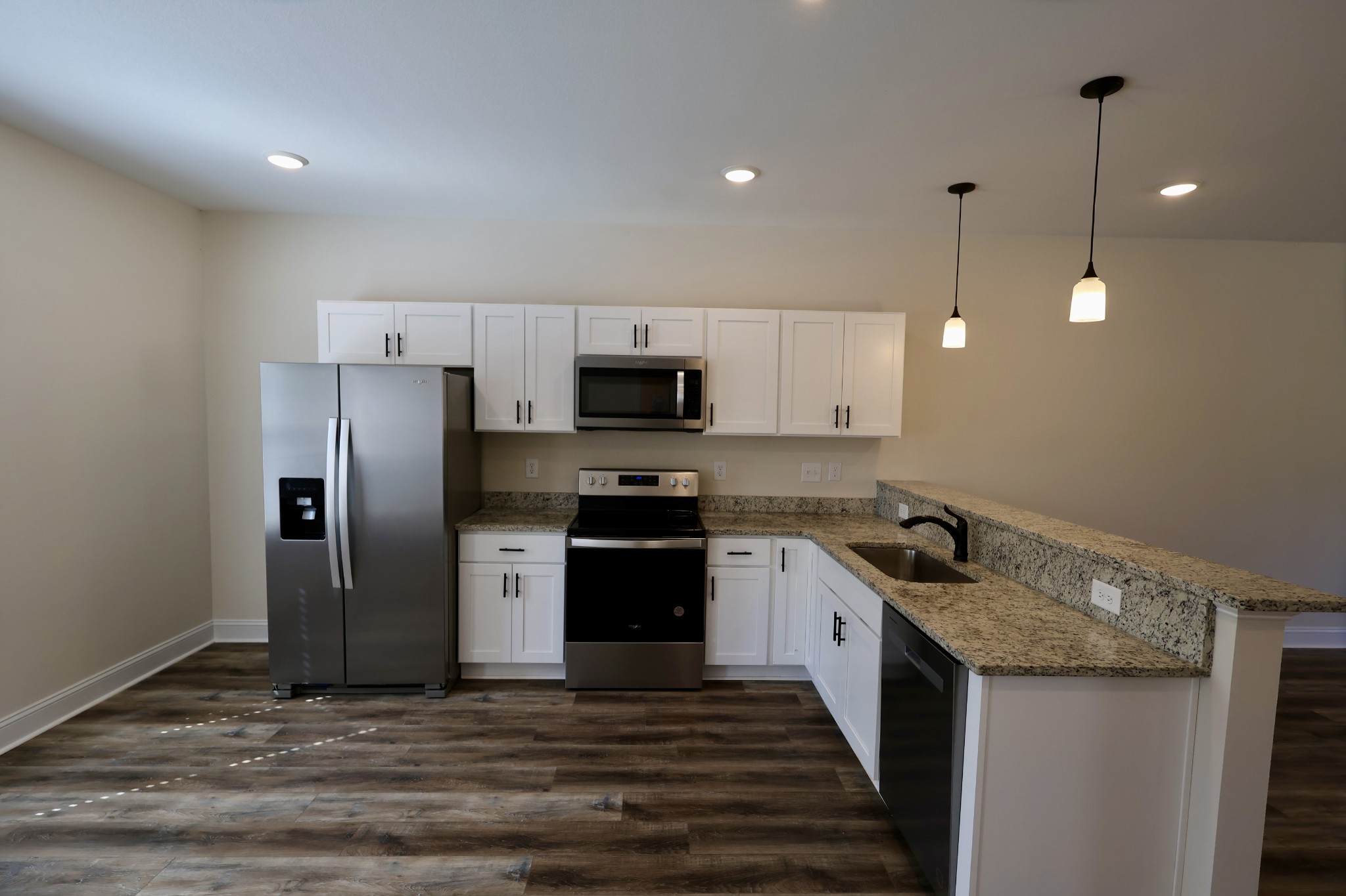 500 Peachers Mill Road, Unit B4 Clarksville, TN 37042 - Photo 5 of 26 a kitchen with stainless steel appliances granite countertop a sink a stove a refrigerator and a microwave