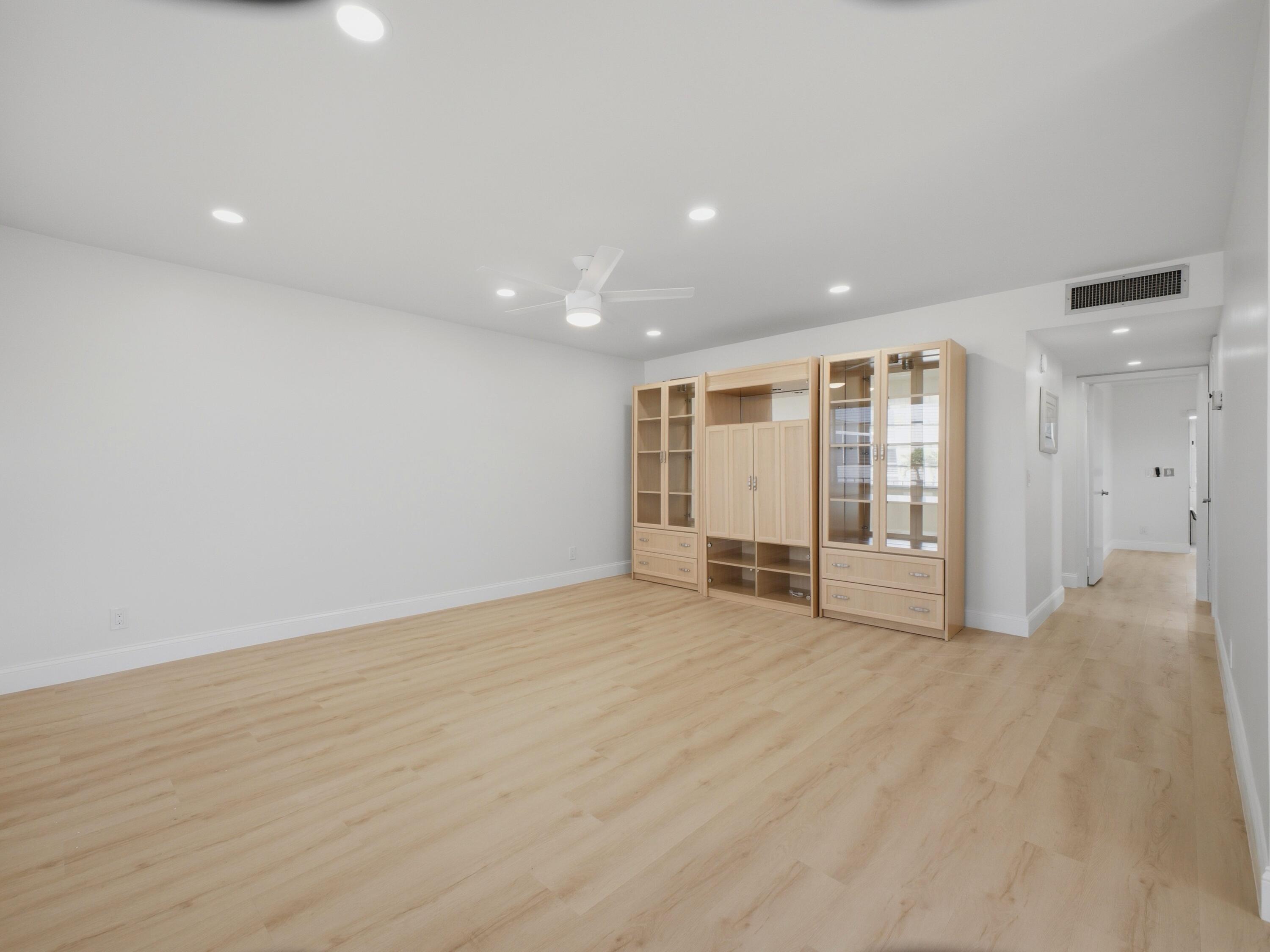 699 Flanders O Delray Beach, FL 33484 - Photo 11 of 39 a view of an empty room with wooden floor
