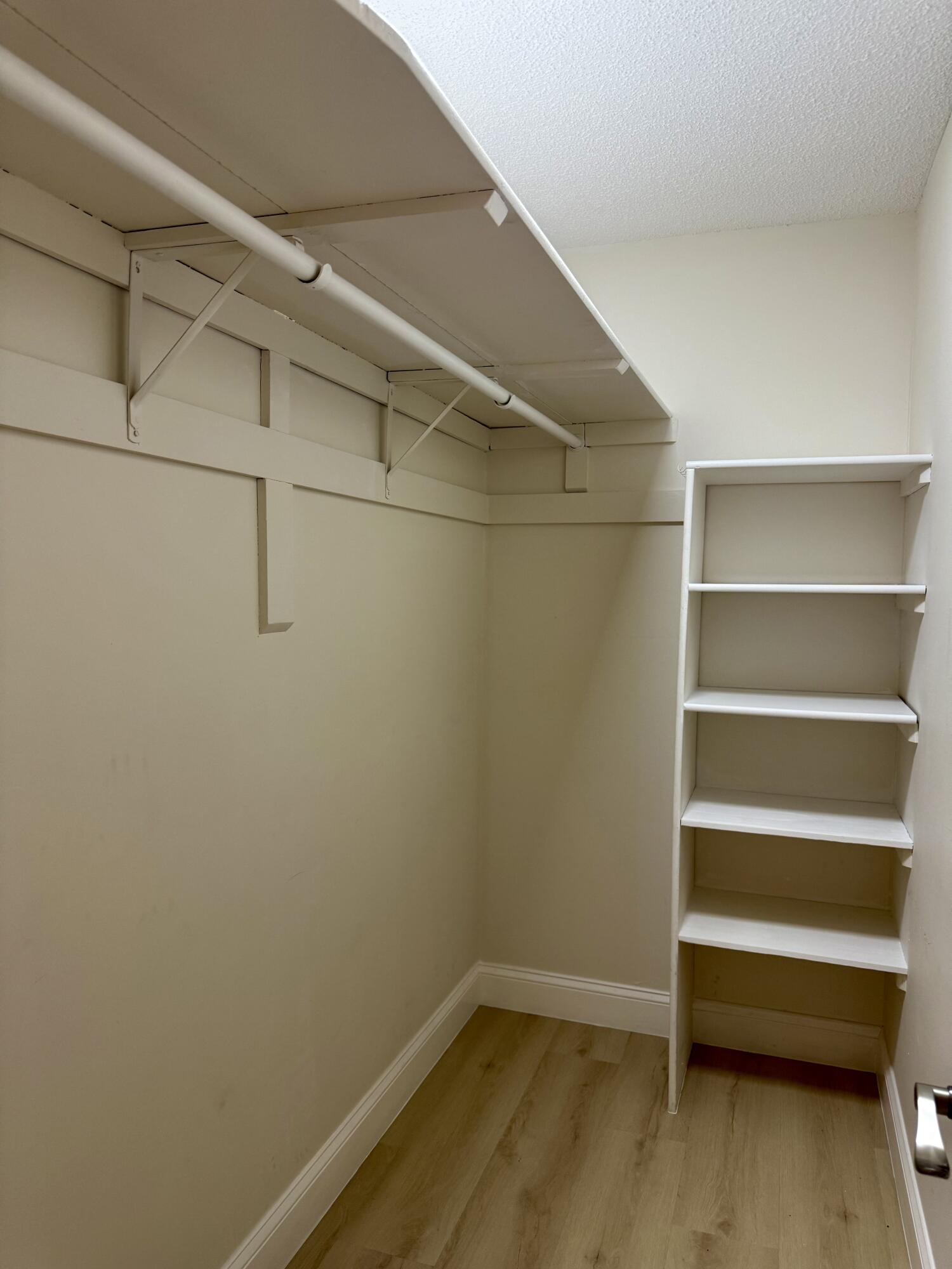 699 Flanders O Delray Beach, FL 33484 - Photo 19 of 39 a view of an empty walk in closet