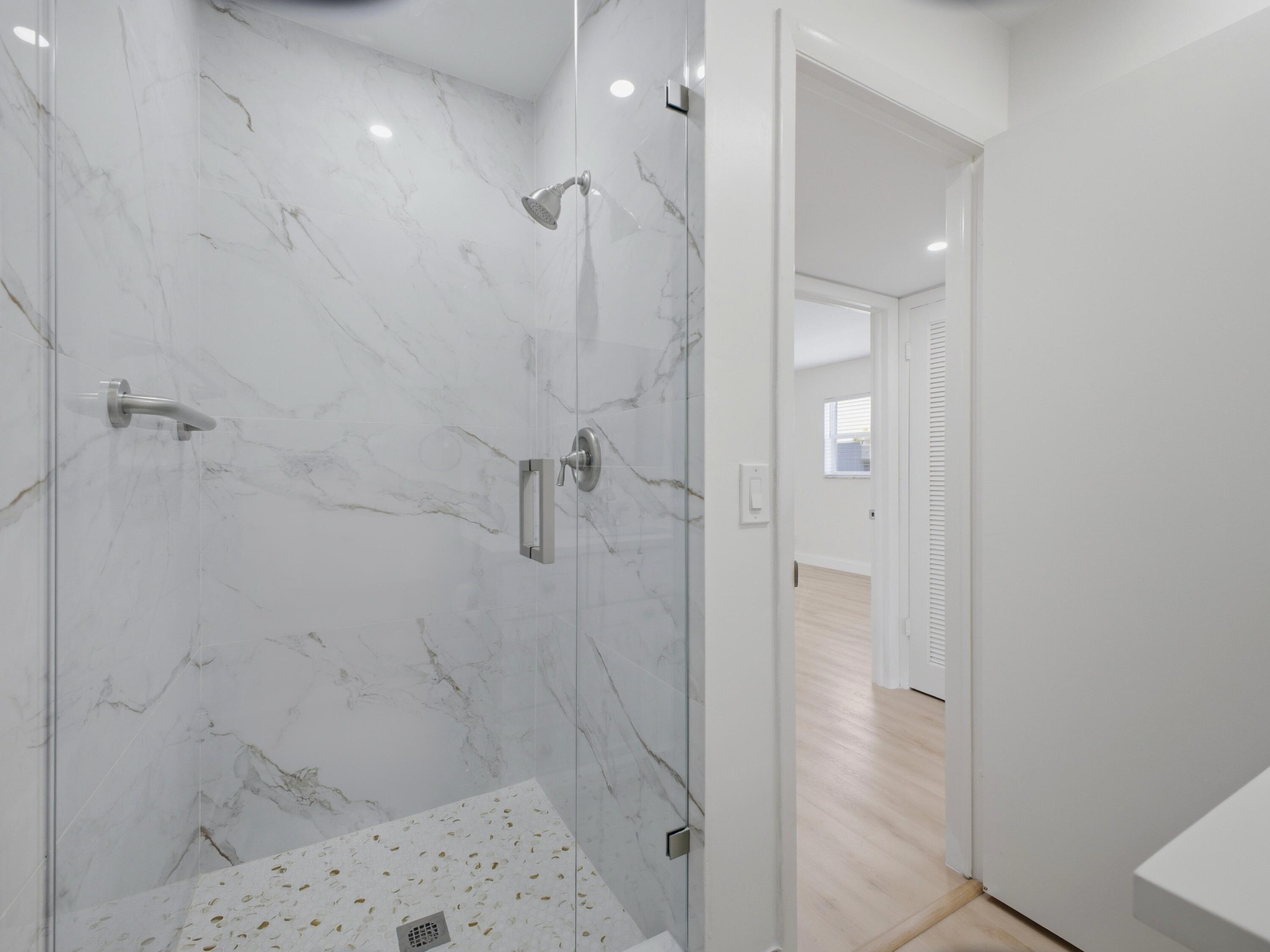 699 Flanders O Delray Beach, FL 33484 - Photo 21 of 39 a bathroom with a shower