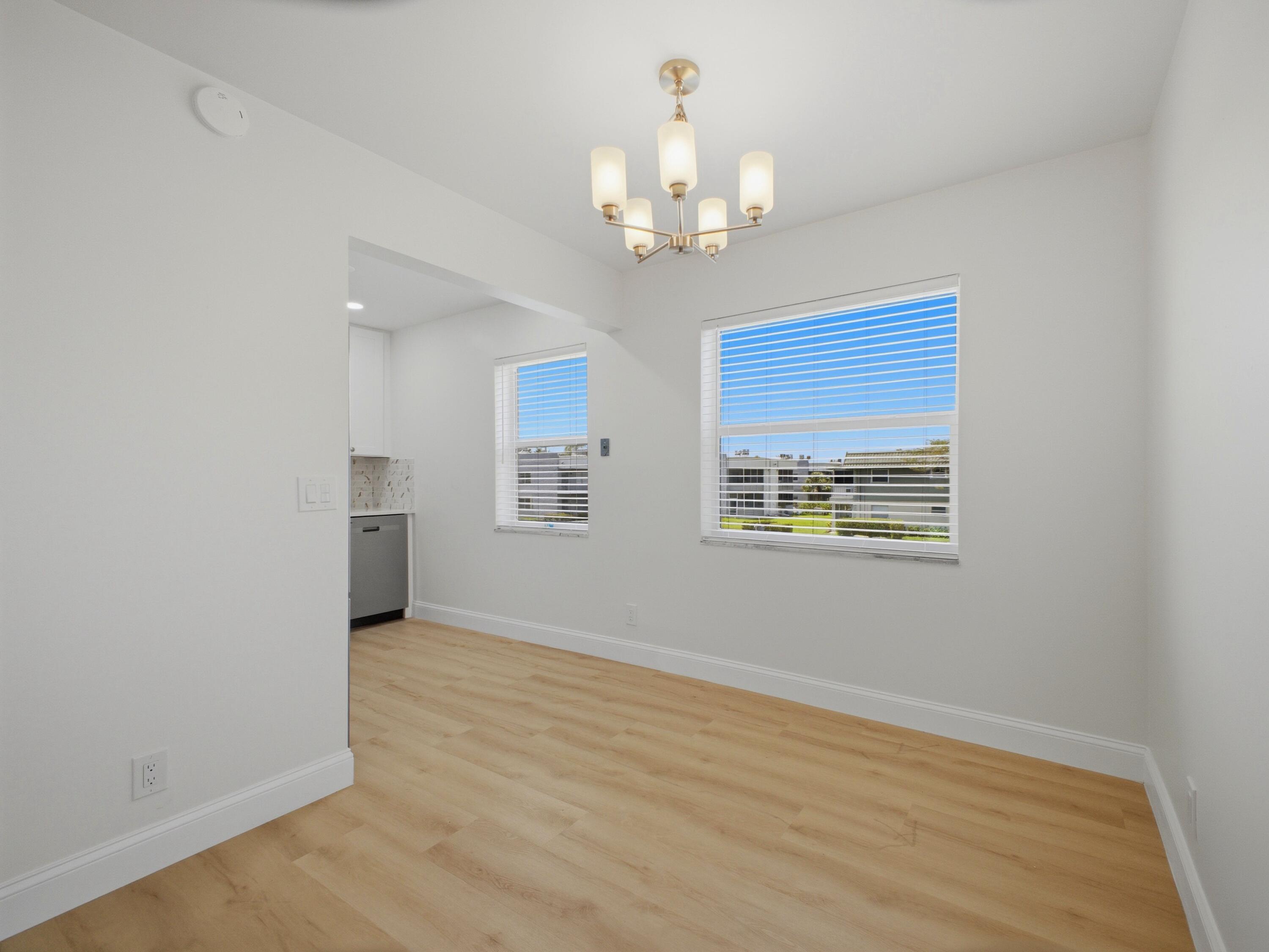 699 Flanders O Delray Beach, FL 33484 - Photo 6 of 39 a view of an empty room with a window