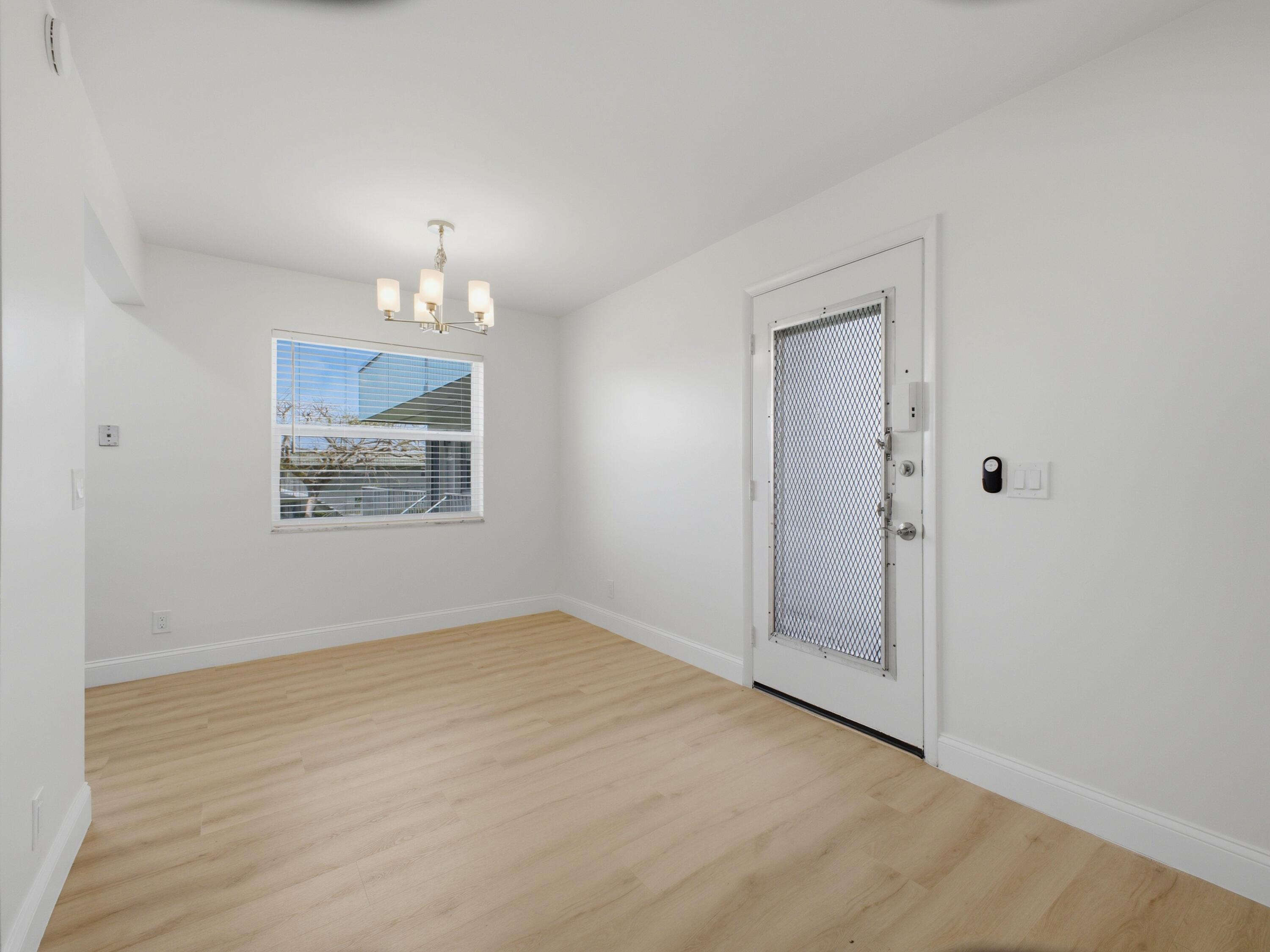 699 Flanders O Delray Beach, FL 33484 - Photo 8 of 39 an empty room with fan