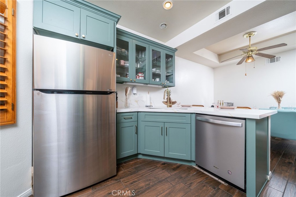 3707 Calle Curacso Riverside, CA 92503 - Photo 14 of 43 a kitchen with a refrigerator and a sink