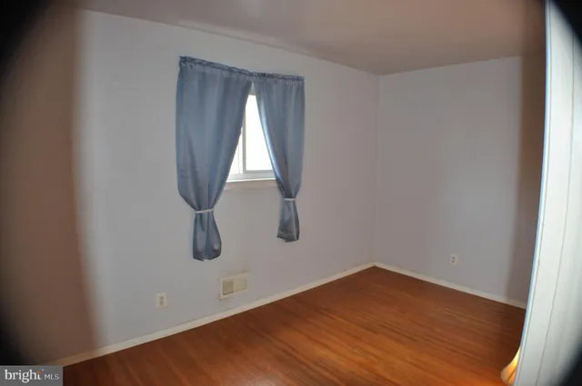 a view of wooden floor and cabinet