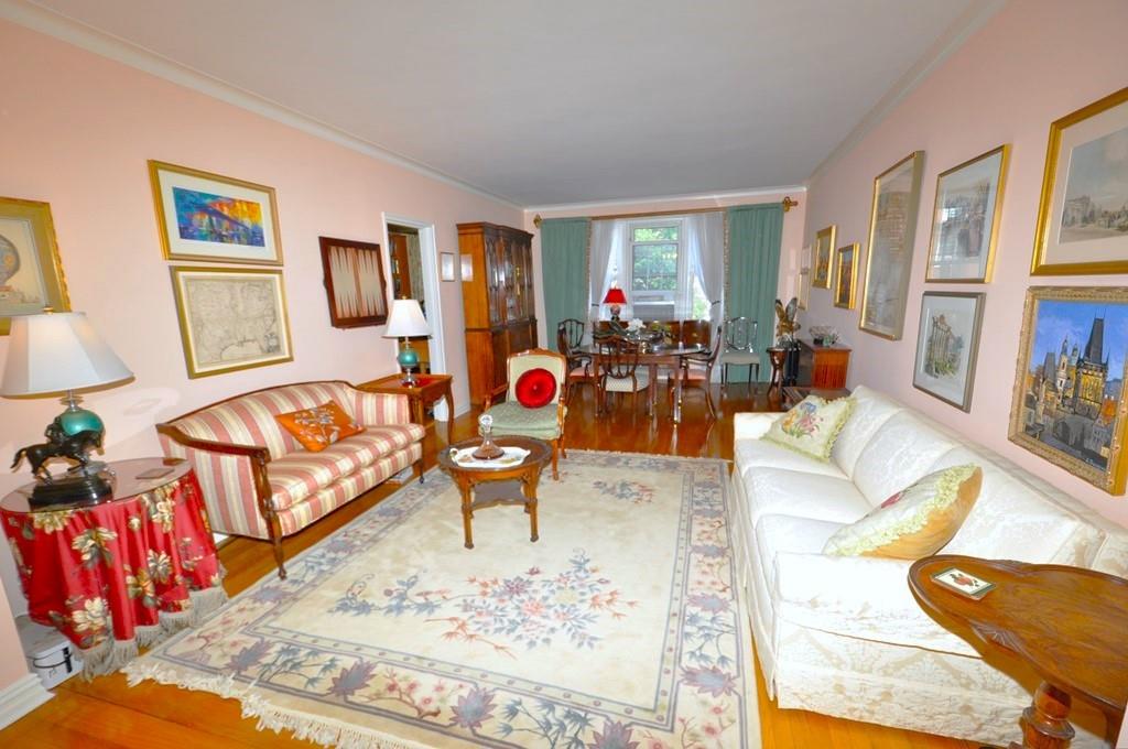 949 Palmer Road, Unit 6B Bronxville, NY 10708 - Photo 1 of 1 Large Living Room with hardwood floors is spacious enough to include a sizable dining area if desired. It offers a sunny Northwestern exposure with tree-top views, and opens to the entrance foyer. The living room is 23'-0" x 13'-6" and the foyer is an additional 12'-0" x 8'-0".