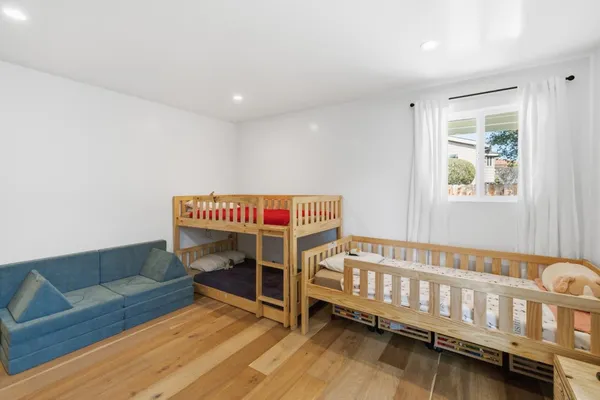 a bedroom with furniture and a window