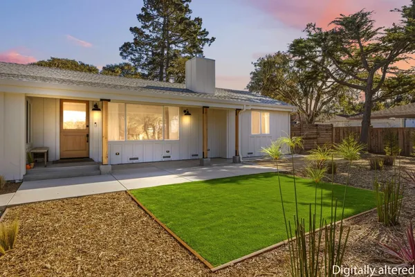 a view of a house with swimming pool and sitting area