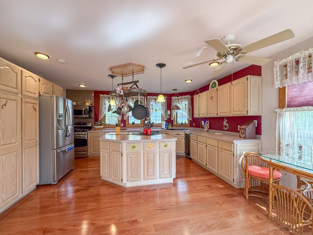 13581 Solitude Trail Machipongo, VA 23405 - Photo 11 of 51 a kitchen with stainless steel appliances granite countertop a refrigerator a oven a stove and a sink