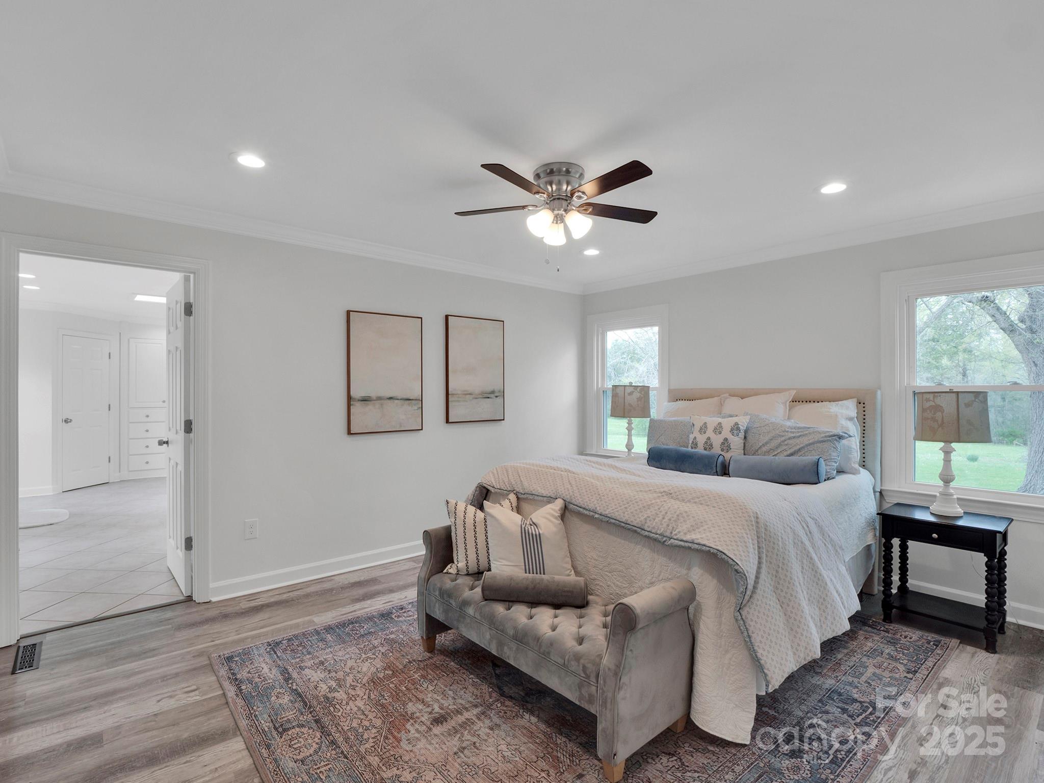 3452 Flat Creek Road Lancaster, SC 29720 - Photo 14 of 34 a bedroom with a bed and a chandelier