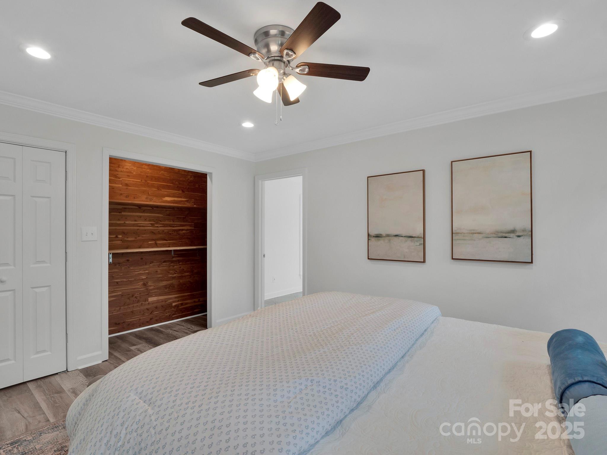 3452 Flat Creek Road Lancaster, SC 29720 - Photo 15 of 34 a bedroom with a bed and a chandelier