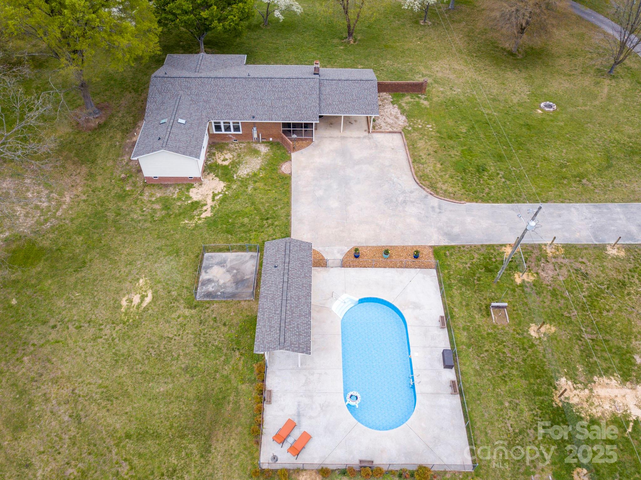 3452 Flat Creek Road Lancaster, SC 29720 - Photo 2 of 34 an aerial view of a house with swimming pool large trees and brick walls