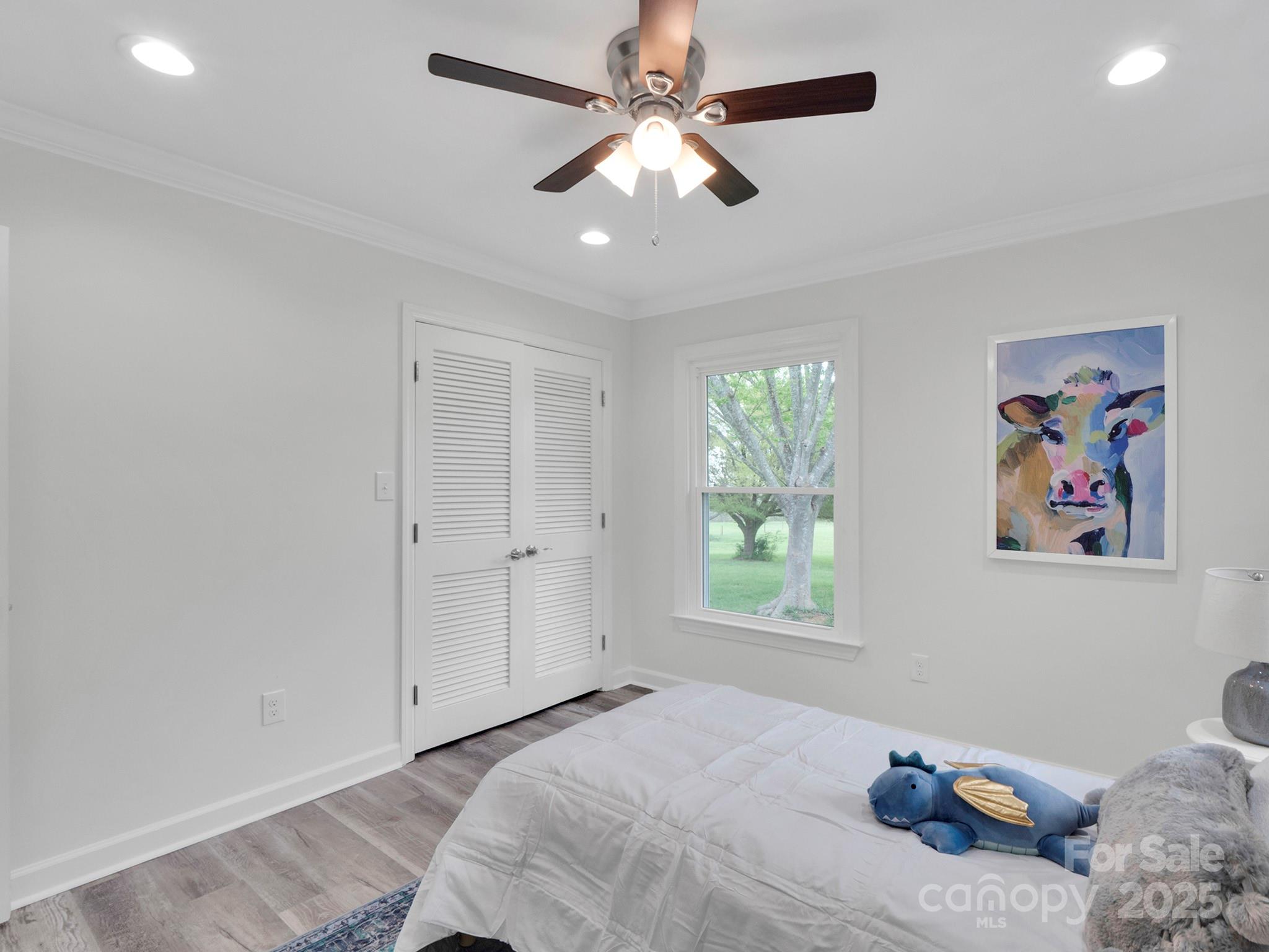 3452 Flat Creek Road Lancaster, SC 29720 - Photo 23 of 34 a bedroom with a bed and a painting on the wall