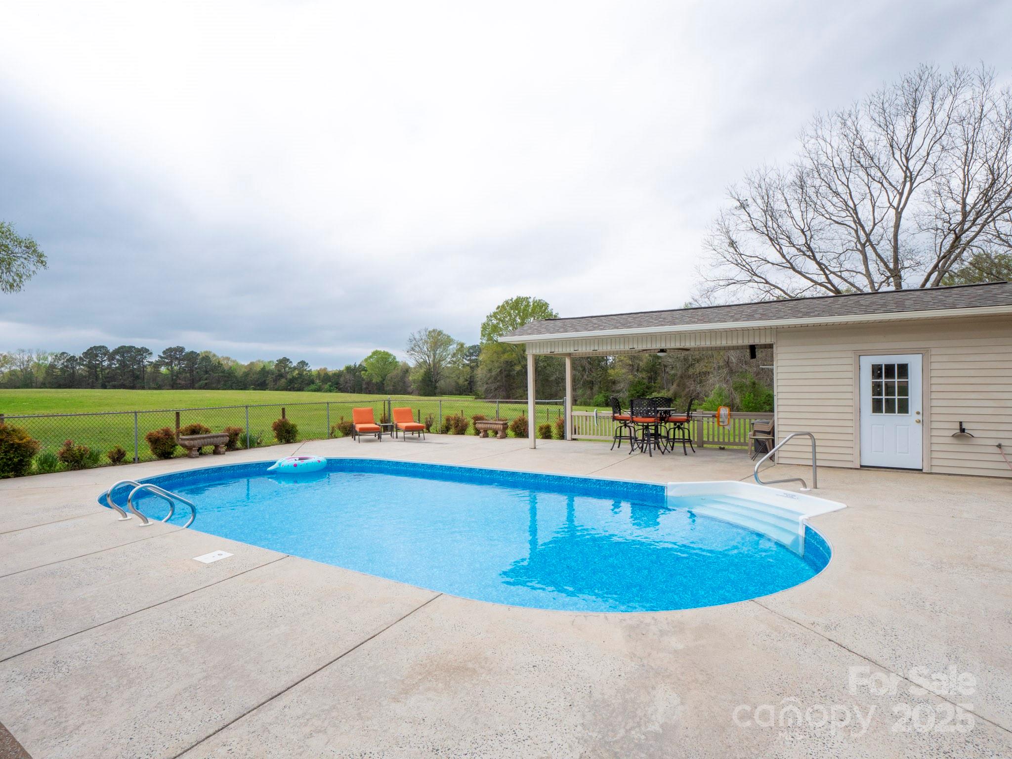 3452 Flat Creek Road Lancaster, SC 29720 - Photo 28 of 34 a view of a house with swimming pool and sitting area