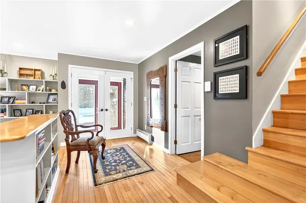 a view of a livingroom with furniture and staircase
