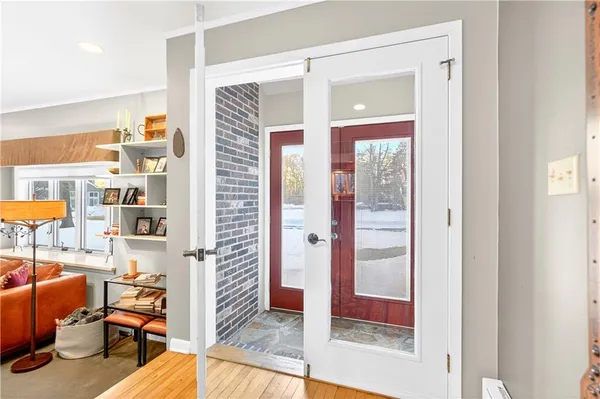 a view of a livingroom with furniture and front door