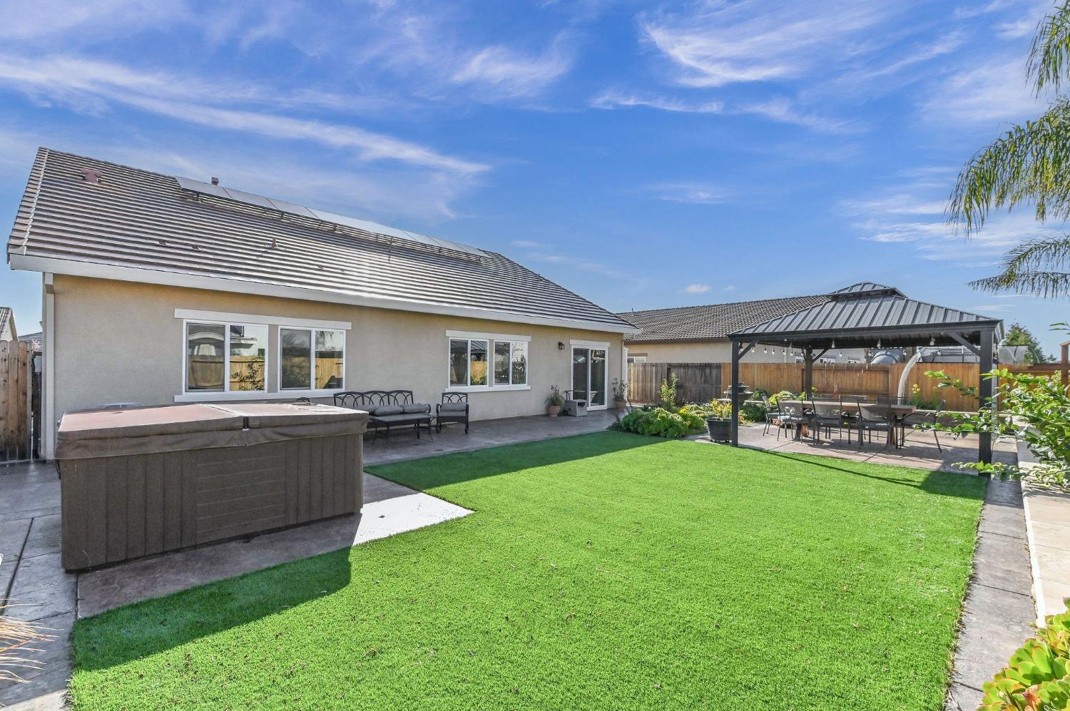 2327 Merlin Lane Manteca, CA 95337 - Photo 1 of 1 a view of a house with a back yard