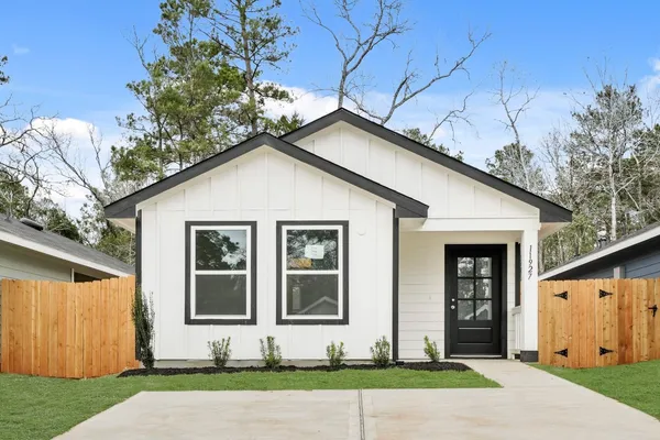 a front view of a house with garage