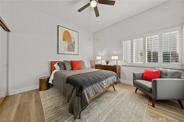 a spacious bedroom with a bed and a couch