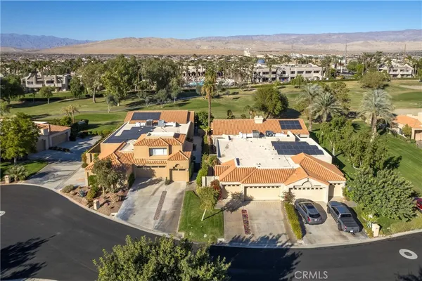 an aerial view of a house with a garden