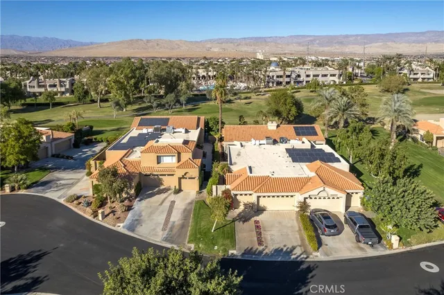 an aerial view of a house with a garden