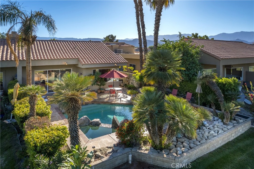 46 Pebble Beach Drive Rancho Mirage, CA 92270 - Photo 27 of 29 a front view of a house with a yard