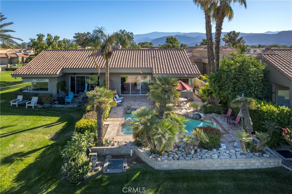 46 Pebble Beach Drive Rancho Mirage, CA 92270 - Photo 28 of 29 a front view of a house with garden