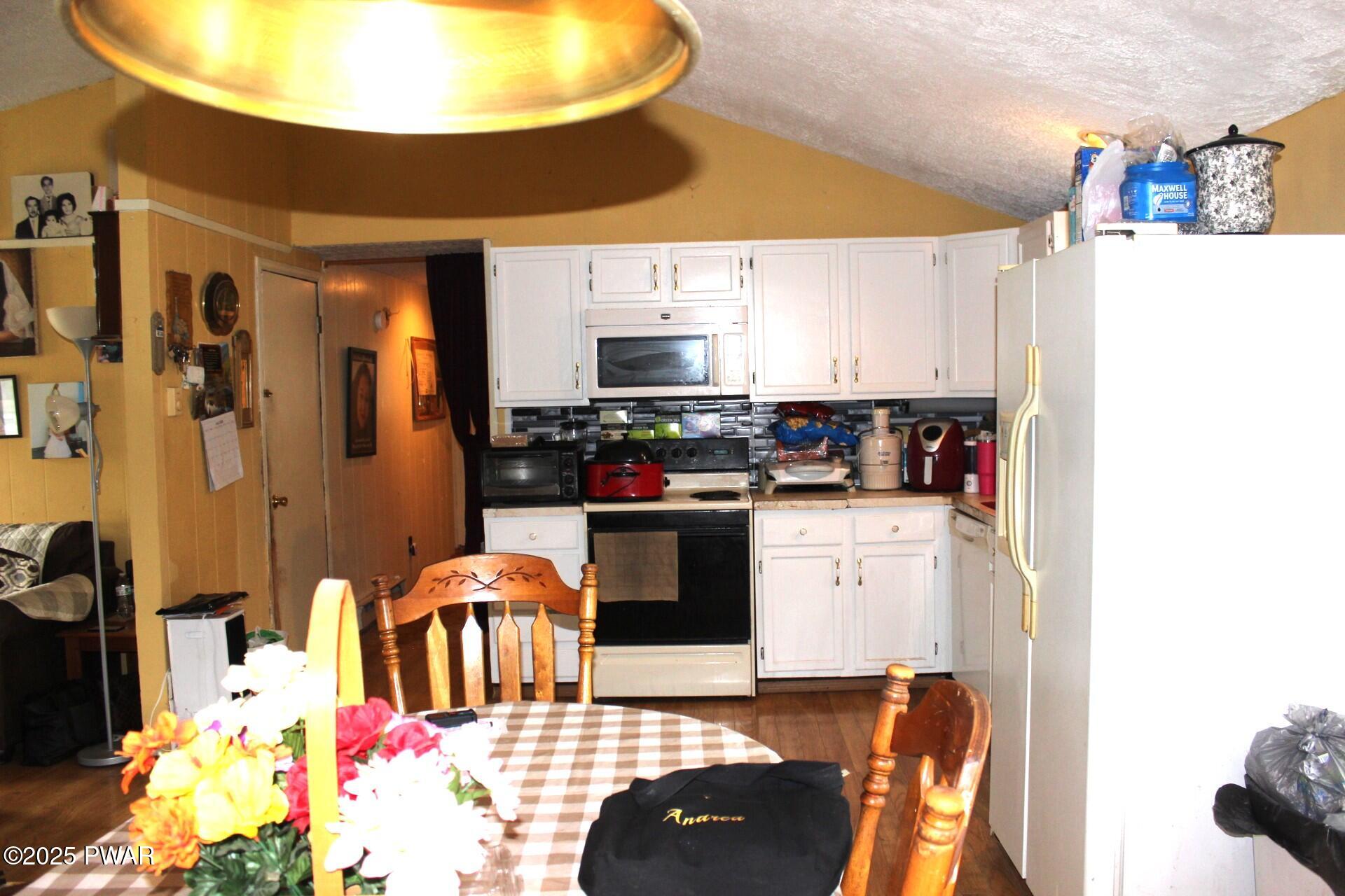 30 Brookfield Road, Unit LOT 1259 Lake Ariel, PA 18436 - Photo 6 of 32 a kitchen with stainless steel appliances kitchen island granite countertop a sink and cabinets