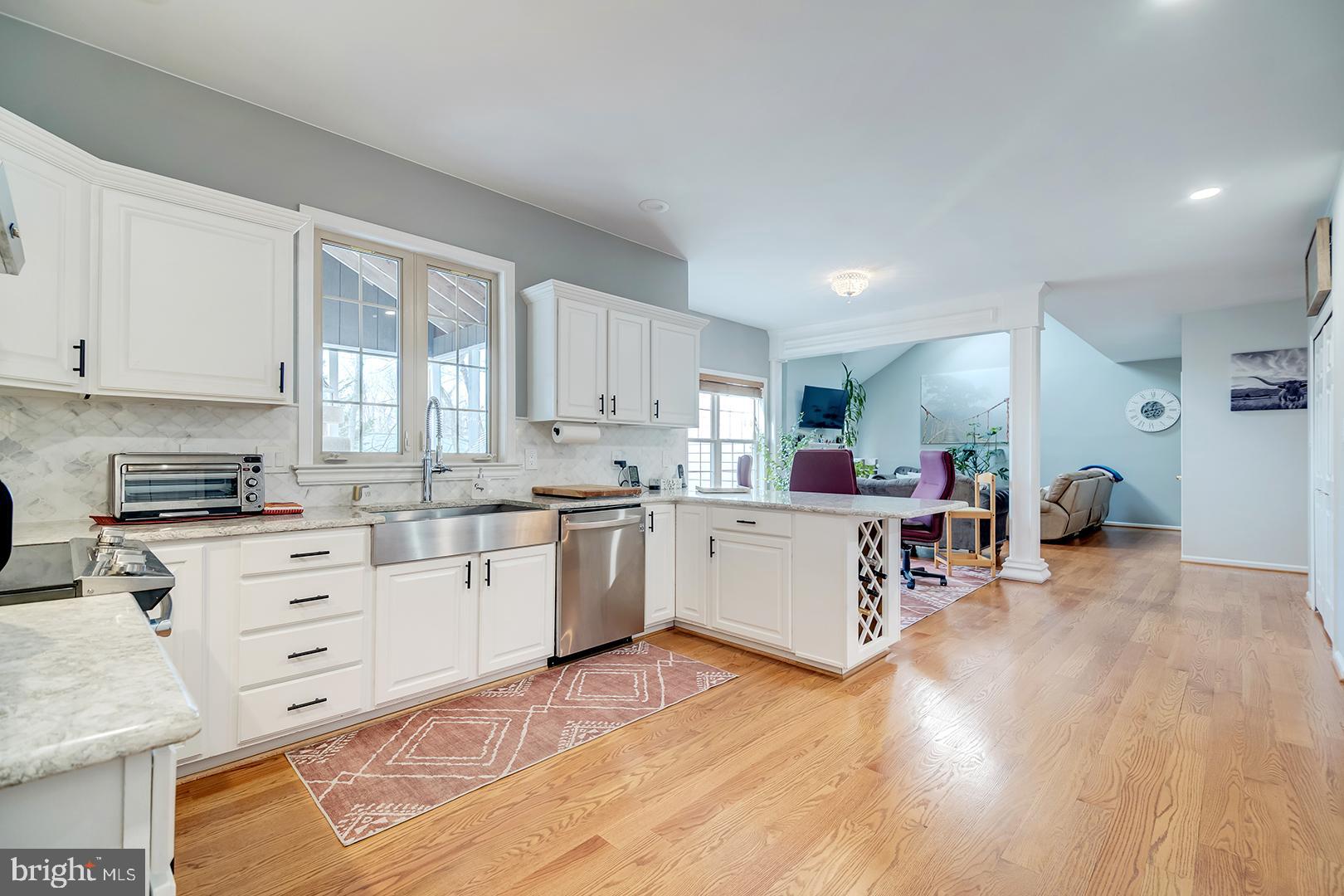 2 Michigan State Drive Newark, DE 19713 - Photo 14 of 65 a kitchen with white cabinets and white appliances