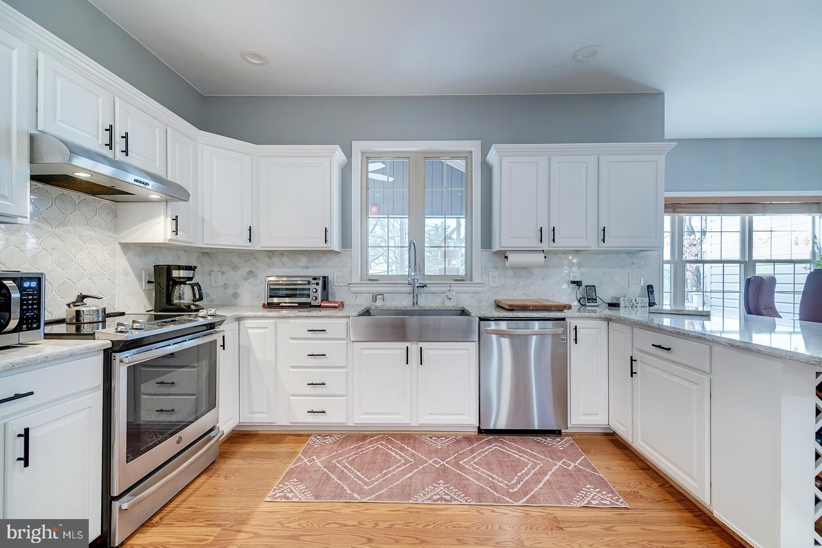 2 Michigan State Drive Newark, DE 19713 - Photo 16 of 65 a kitchen with cabinets stainless steel appliances and a window