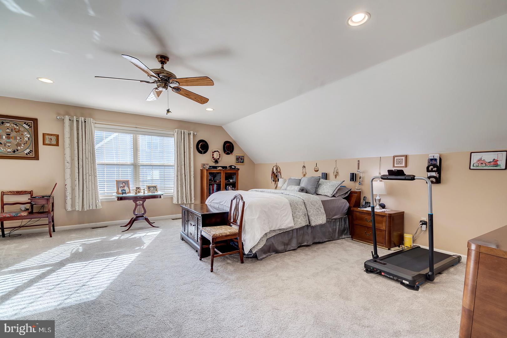 2 Michigan State Drive Newark, DE 19713 - Photo 40 of 65 a spacious bedroom with a bed a chair and a chandelier