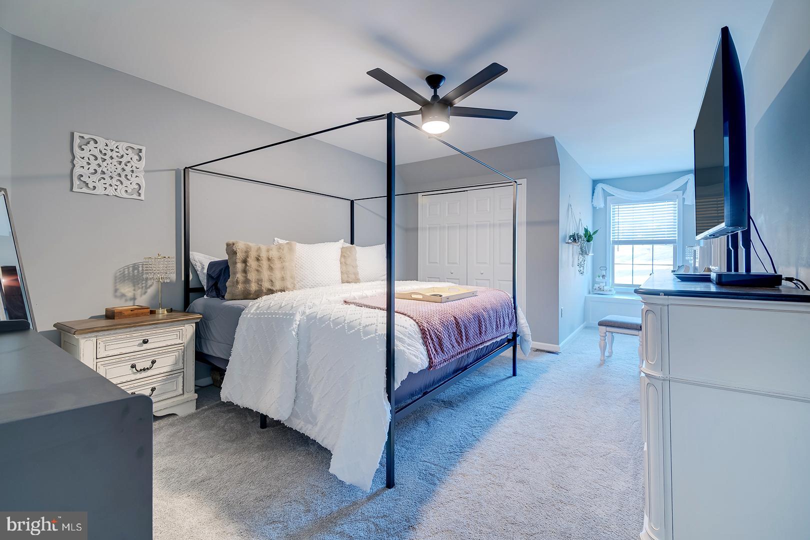 2 Michigan State Drive Newark, DE 19713 - Photo 45 of 65 a bedroom with a bed and a chandelier