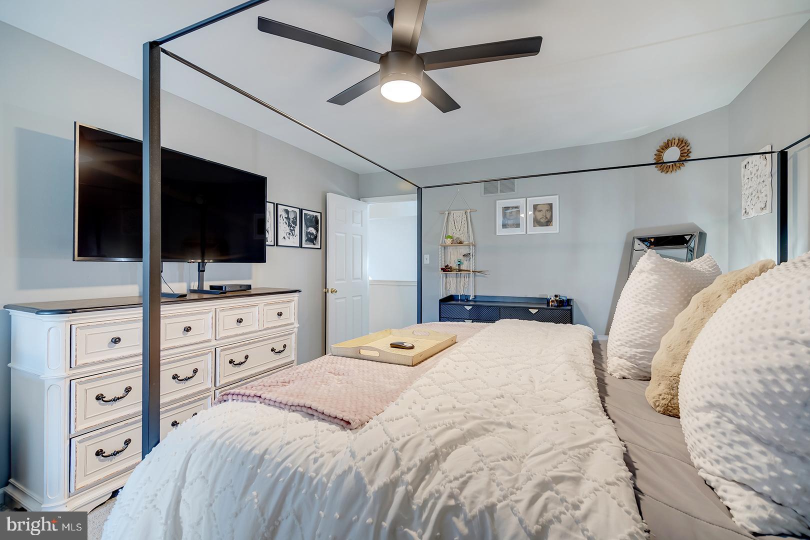 2 Michigan State Drive Newark, DE 19713 - Photo 46 of 65 a bedroom with a large bed and a flat tv screen on dresser