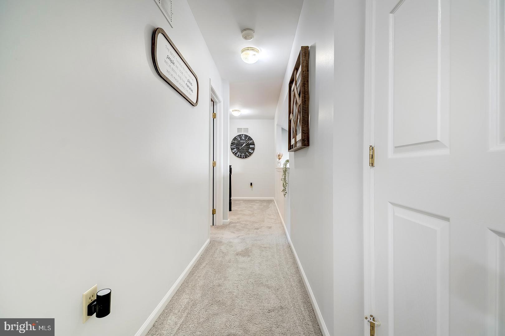 2 Michigan State Drive Newark, DE 19713 - Photo 48 of 65 a view of a hallway with wooden floor and entryway