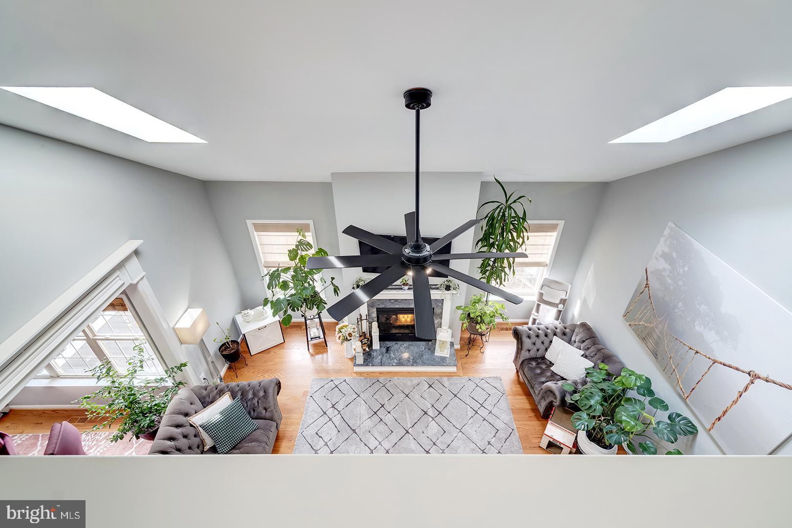 2 Michigan State Drive Newark, DE 19713 - Photo 10 of 65 a living room with furniture a fireplace and a flat screen tv
