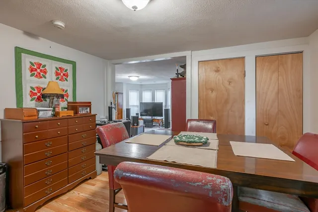 a room with a desk and chair with wooden floor