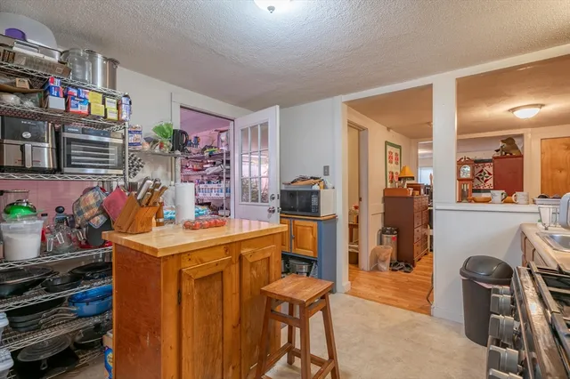 a view of a kitchen and dining room