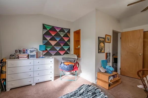 a room with toys and dresser