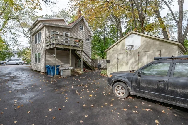 a front view of a house with parking area