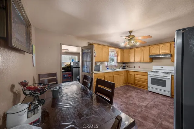 a kitchen with a dining table and chairs