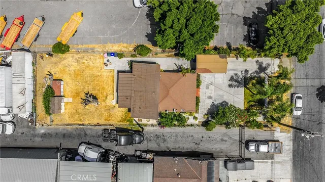 an aerial view of residential houses and city street