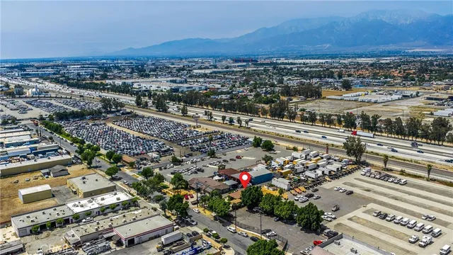 an aerial view of residential houses with city view