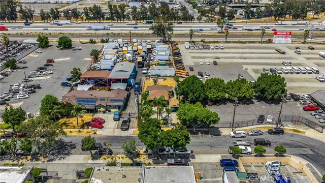 an aerial view of residential houses with city view