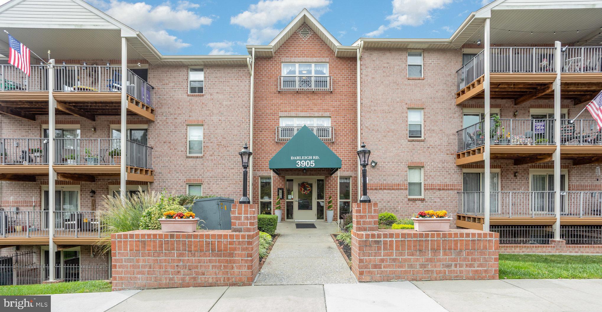 3905 Darleigh Road, Unit F Nottingham, MD 21236 - Photo 1 of 33 a front view of a house with a garden and plants