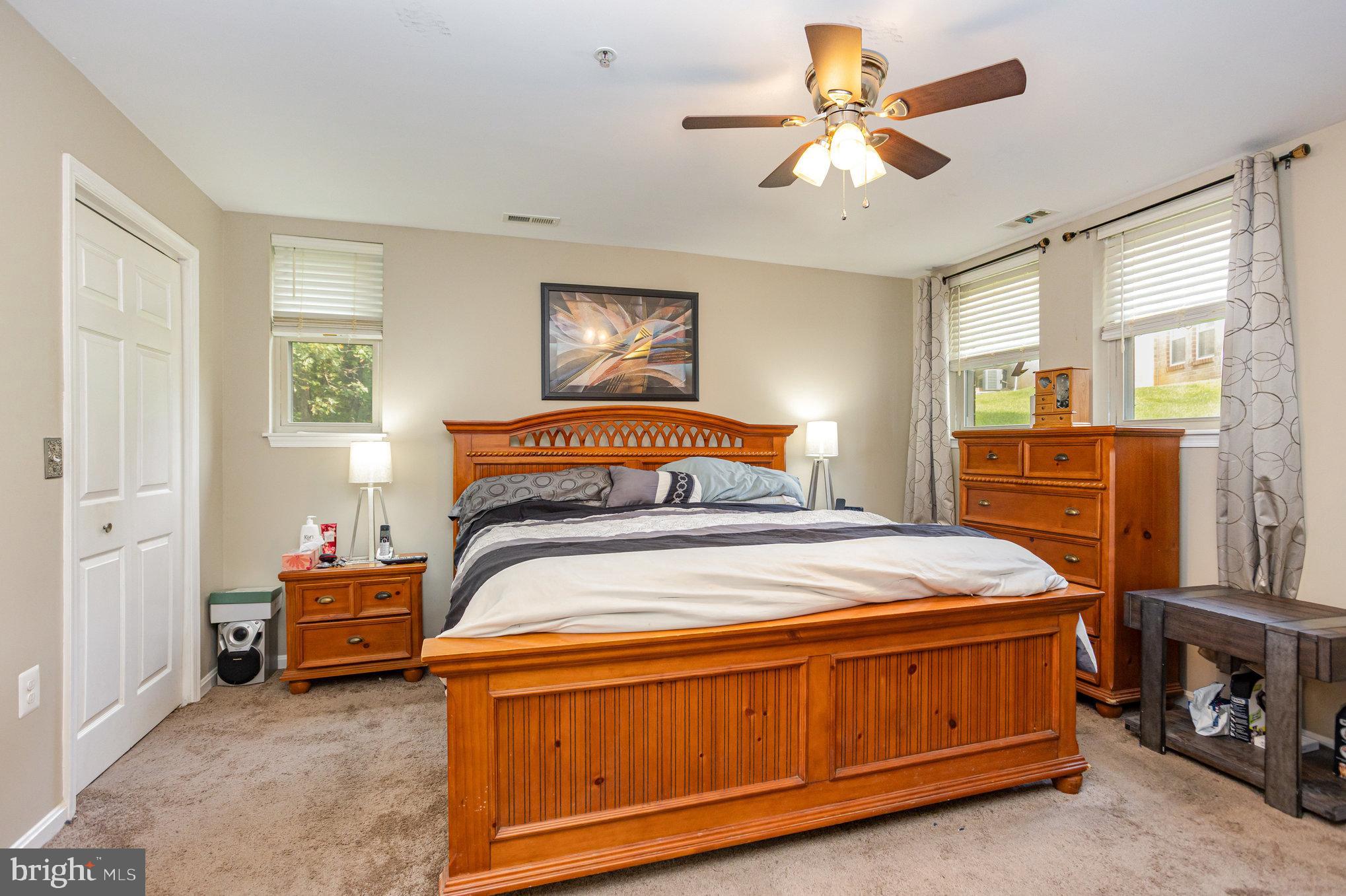 3905 Darleigh Road, Unit F Nottingham, MD 21236 - Photo 17 of 33 a bedroom with a bed and a chandelier