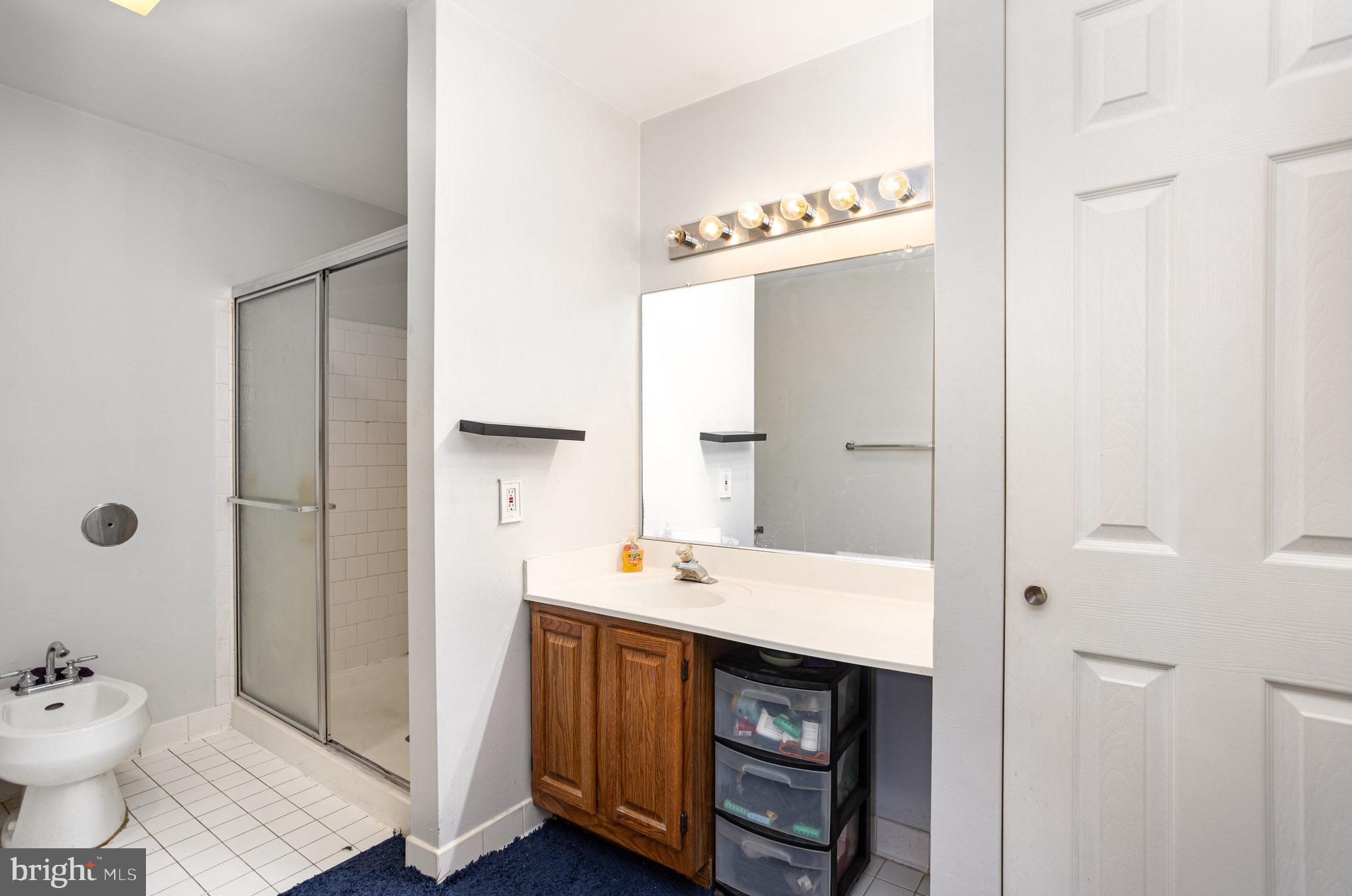 3905 Darleigh Road, Unit F Nottingham, MD 21236 - Photo 19 of 33 a bathroom with a sink and a mirror