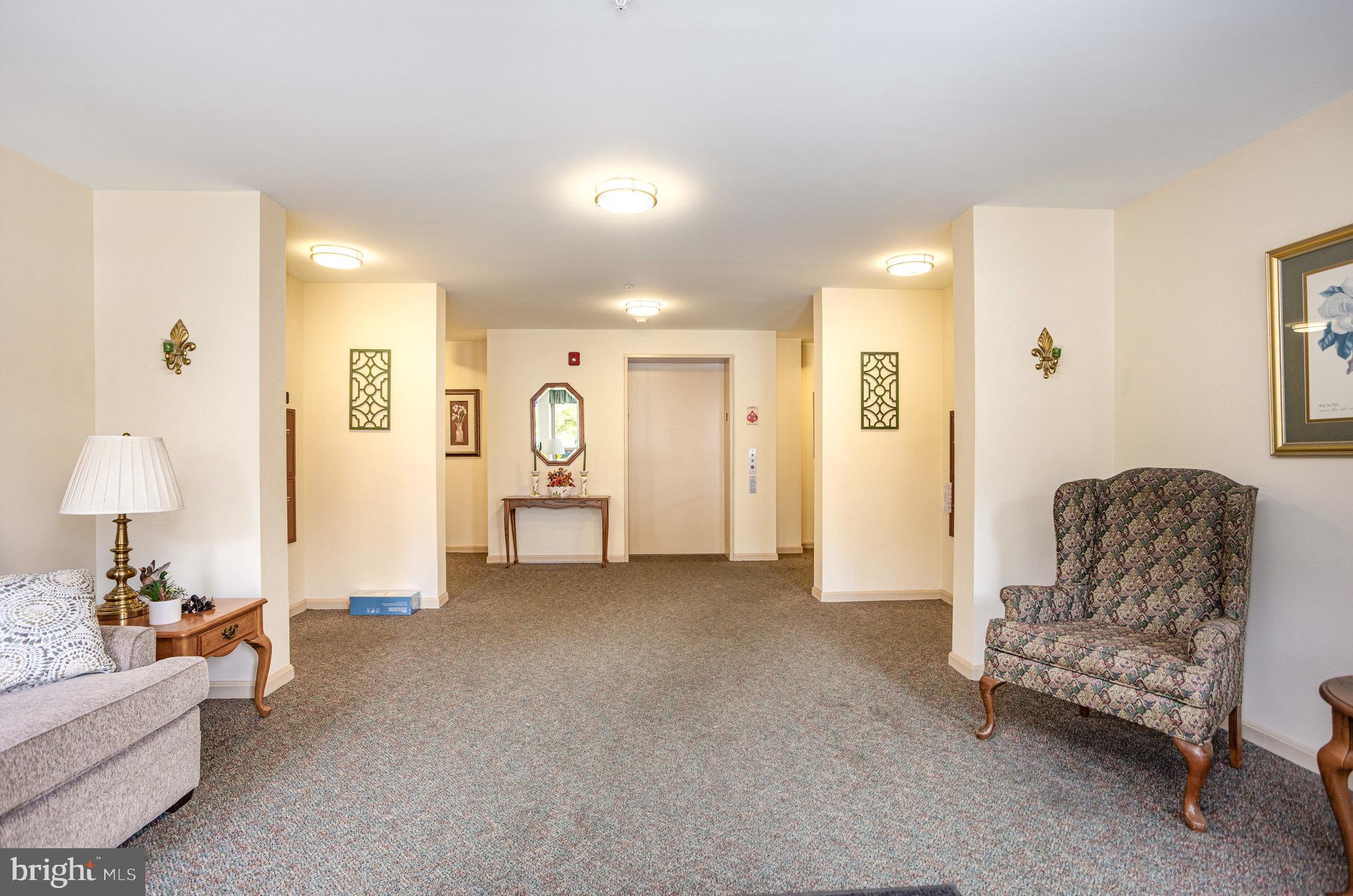 3905 Darleigh Road, Unit F Nottingham, MD 21236 - Photo 2 of 33 a living room with furniture and a lamp