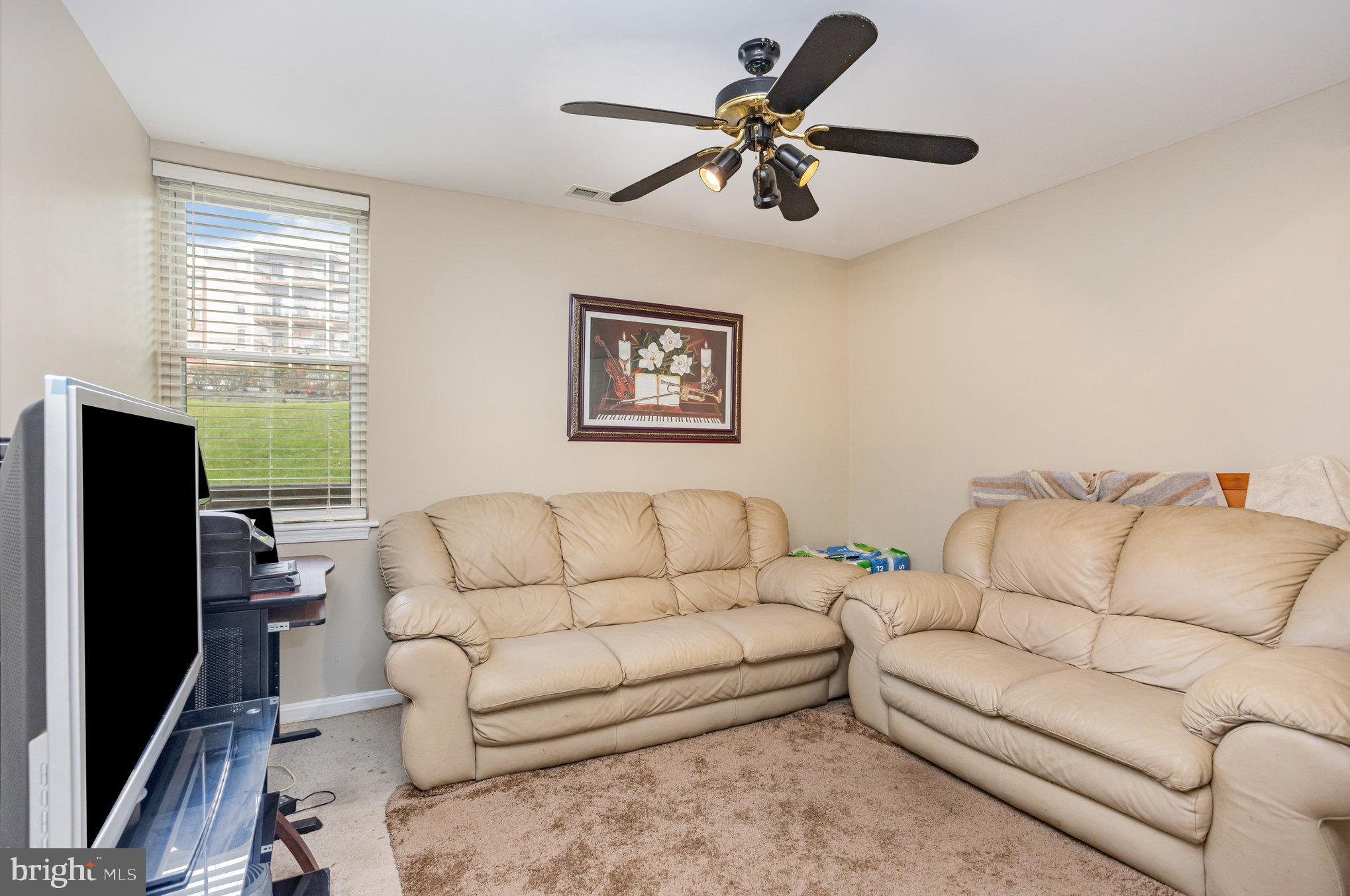 3905 Darleigh Road, Unit F Nottingham, MD 21236 - Photo 24 of 33 a living room with furniture and a flat screen tv
