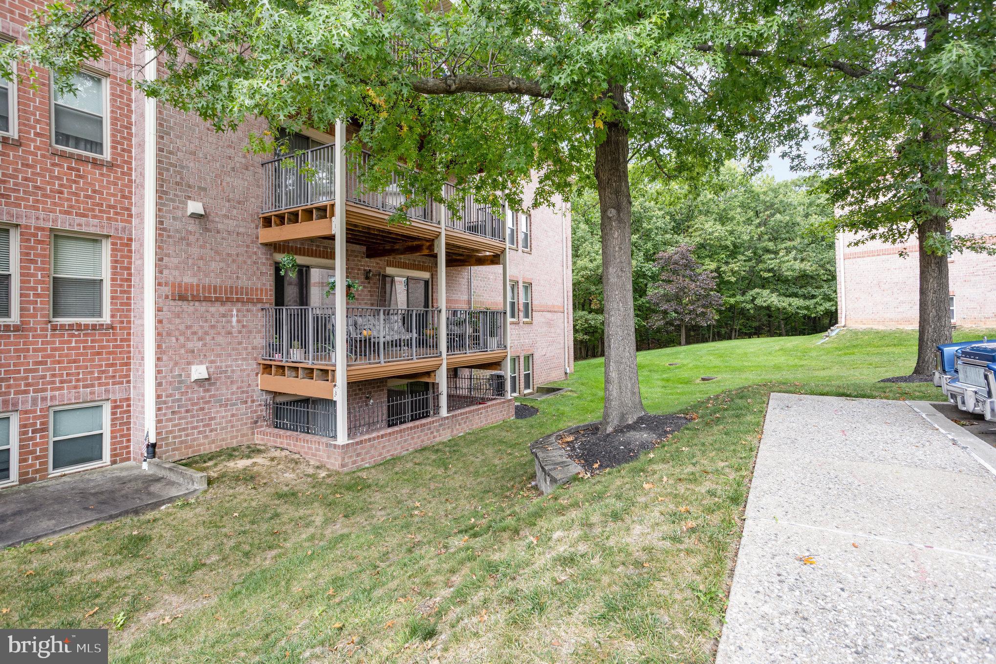 3905 Darleigh Road, Unit F Nottingham, MD 21236 - Photo 31 of 33 front view of a house with a yard