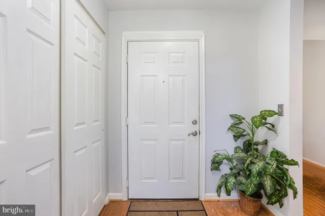 a view of an entryway with wooden floor